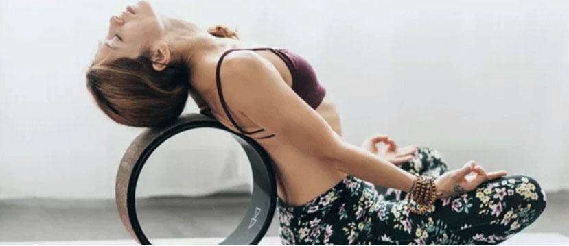 Lotus-Posture-with-Yoga-Wheel